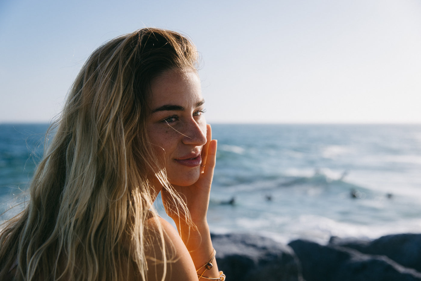 Molly Tuschen smiling by the ocean